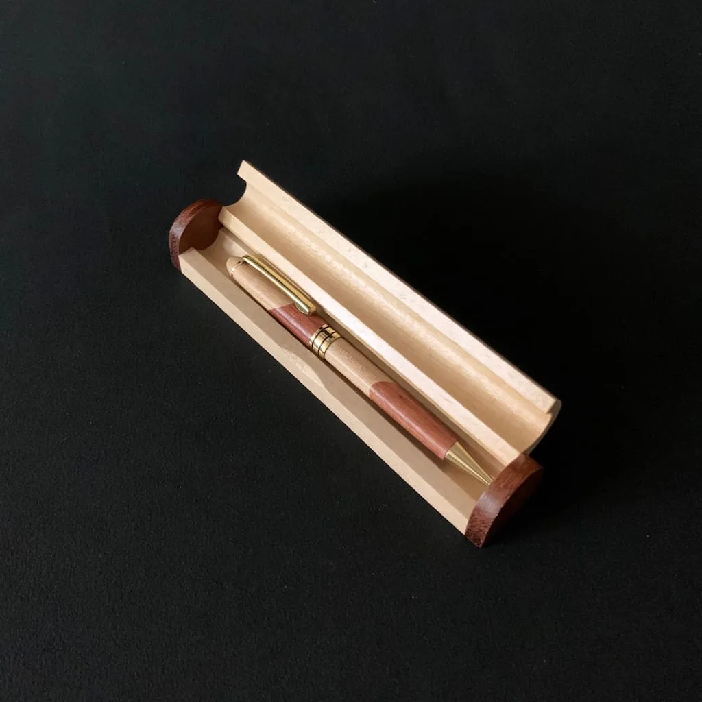 Personalized laser engraved maple and rosewood pen case open showing two-tone wood grain and interior