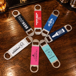 Personalized laser engraved silicone grip bottle openers displayed in multiple colors