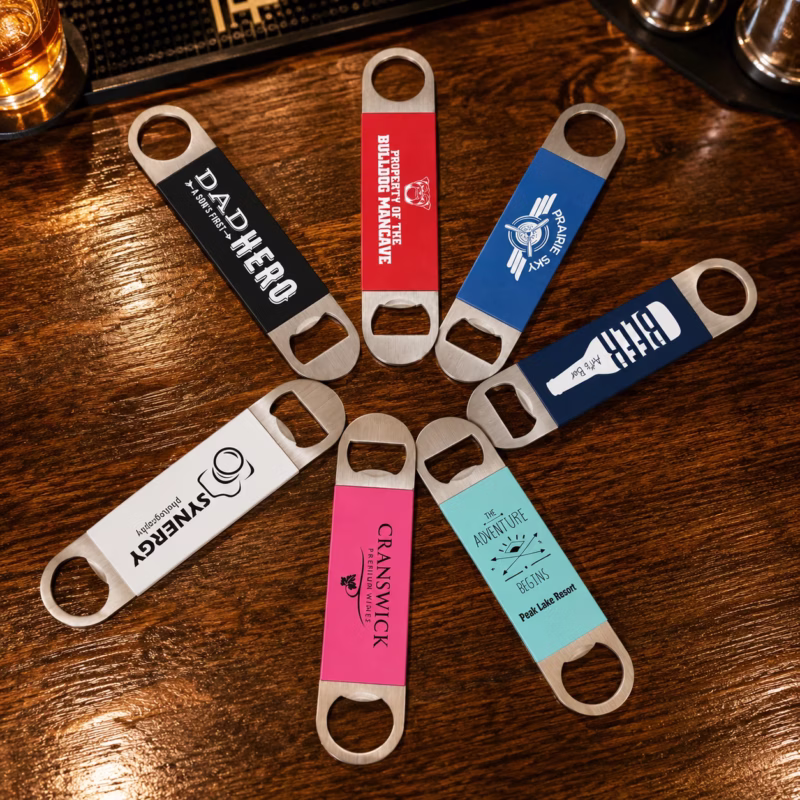 bottle openers staged photo Personalized laser engraved silicone grip bottle openers displayed in multiple colors