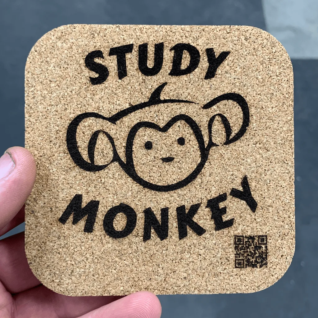 Close-up of laser engraving detail on 4-inch square cork coaster, made in USA
